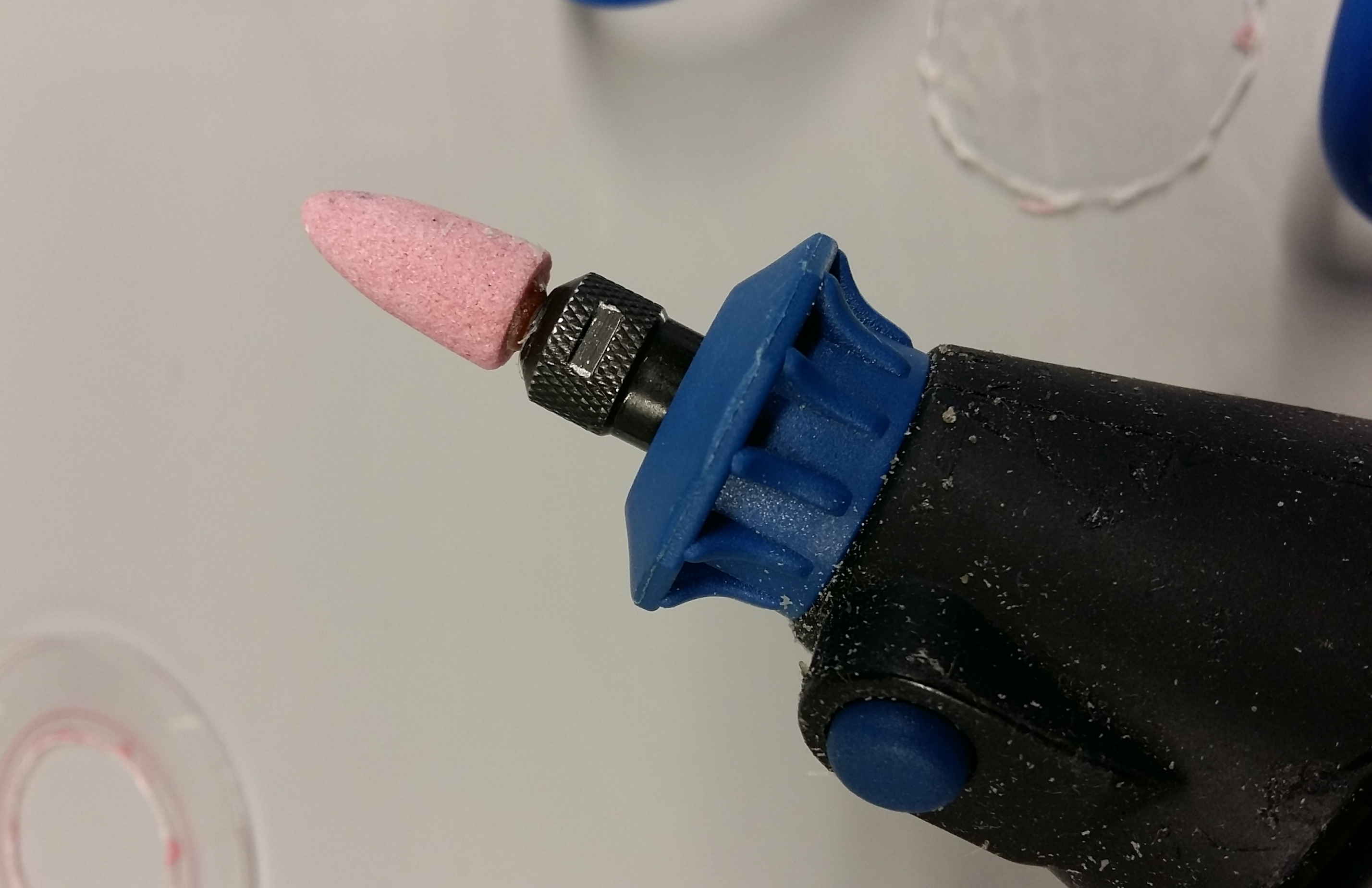 Rotary tool with grinding attachment.