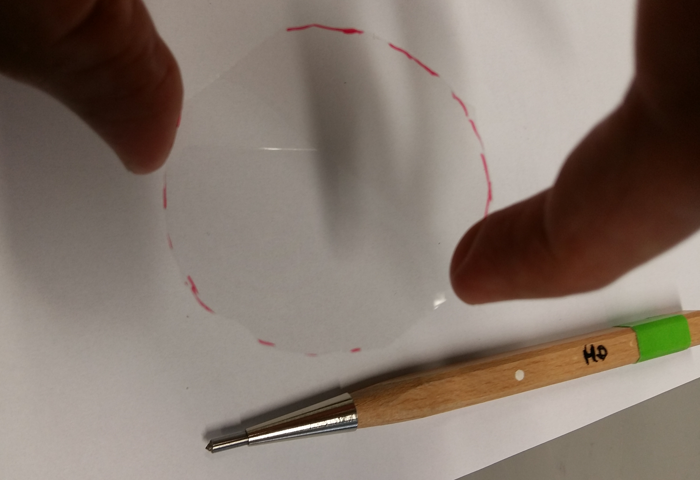Resulting cover slip and diamond pen in the background.