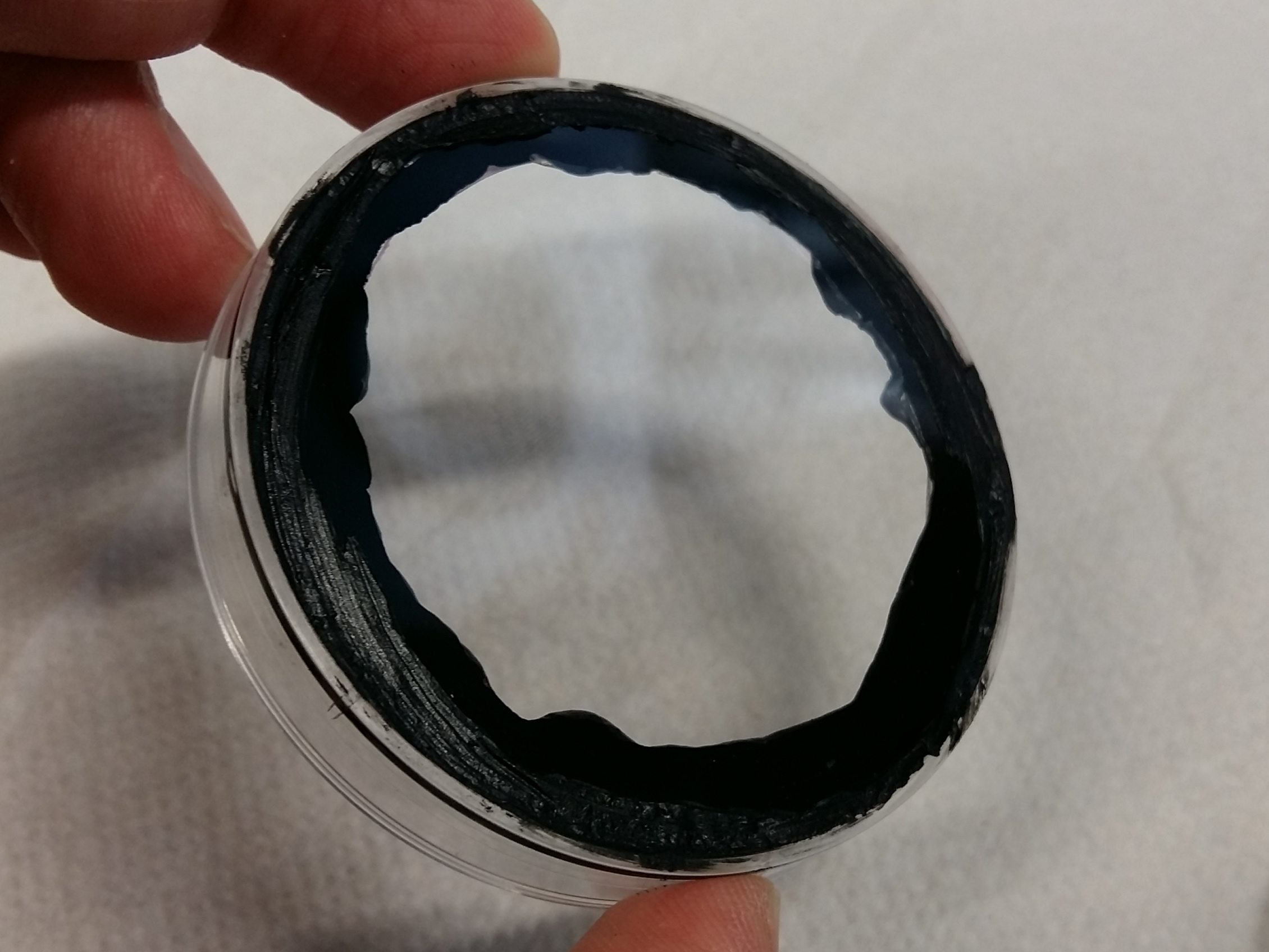 Cover slip pressed on the ring of silicone on the underside of the smaller petri dish.